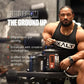 Muscular man holding EXALT protein supplement with promotional text in a gym setting
