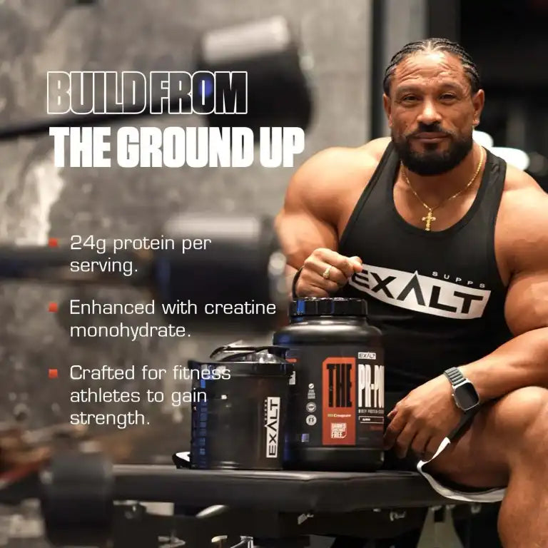 Muscular man holding EXALT protein supplement with promotional text in a gym setting